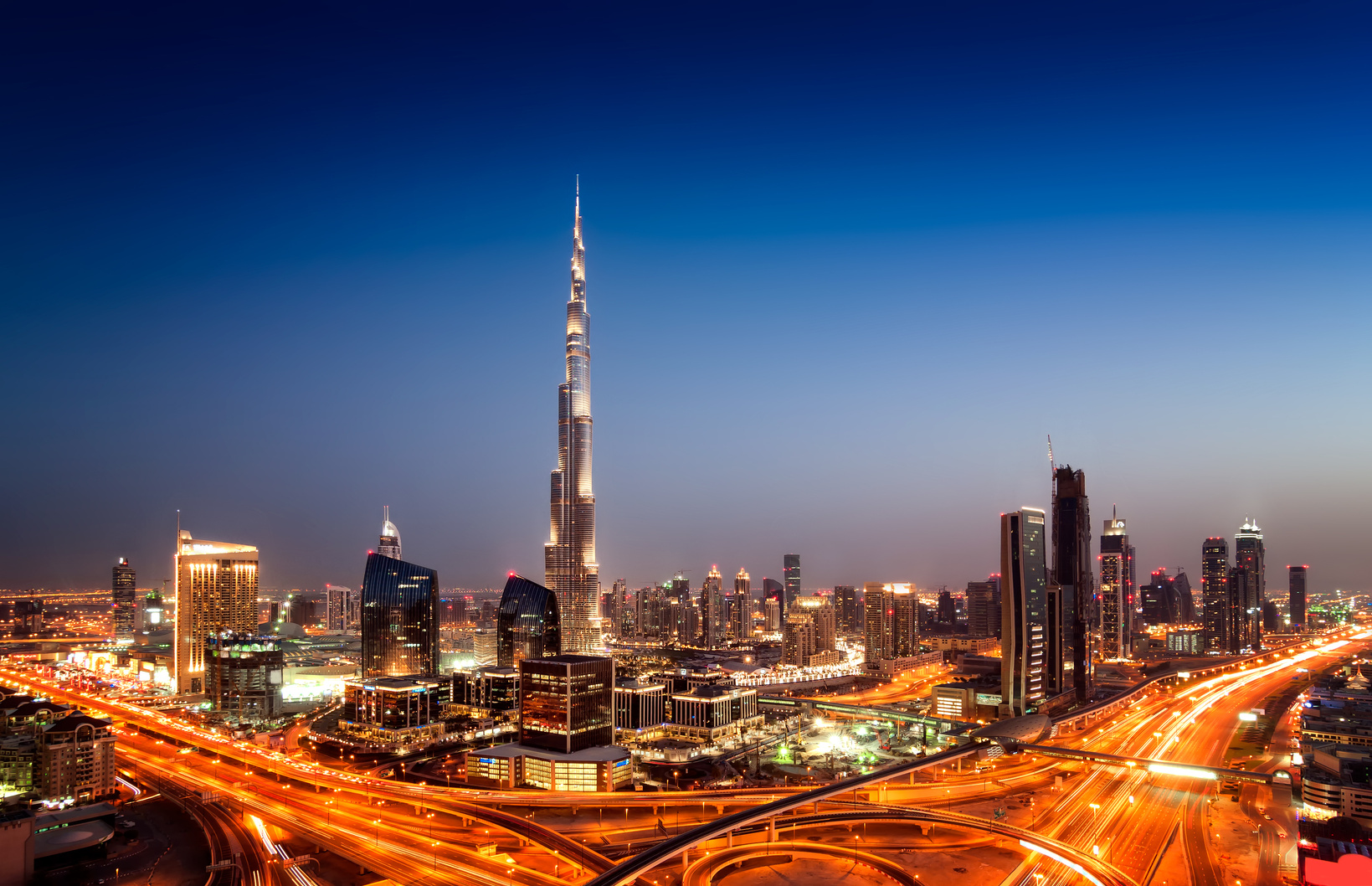 Sunset dubai downtown skyline with tallest skyscrapers and beautiful blue sky, Dubai, United Arab Emirates